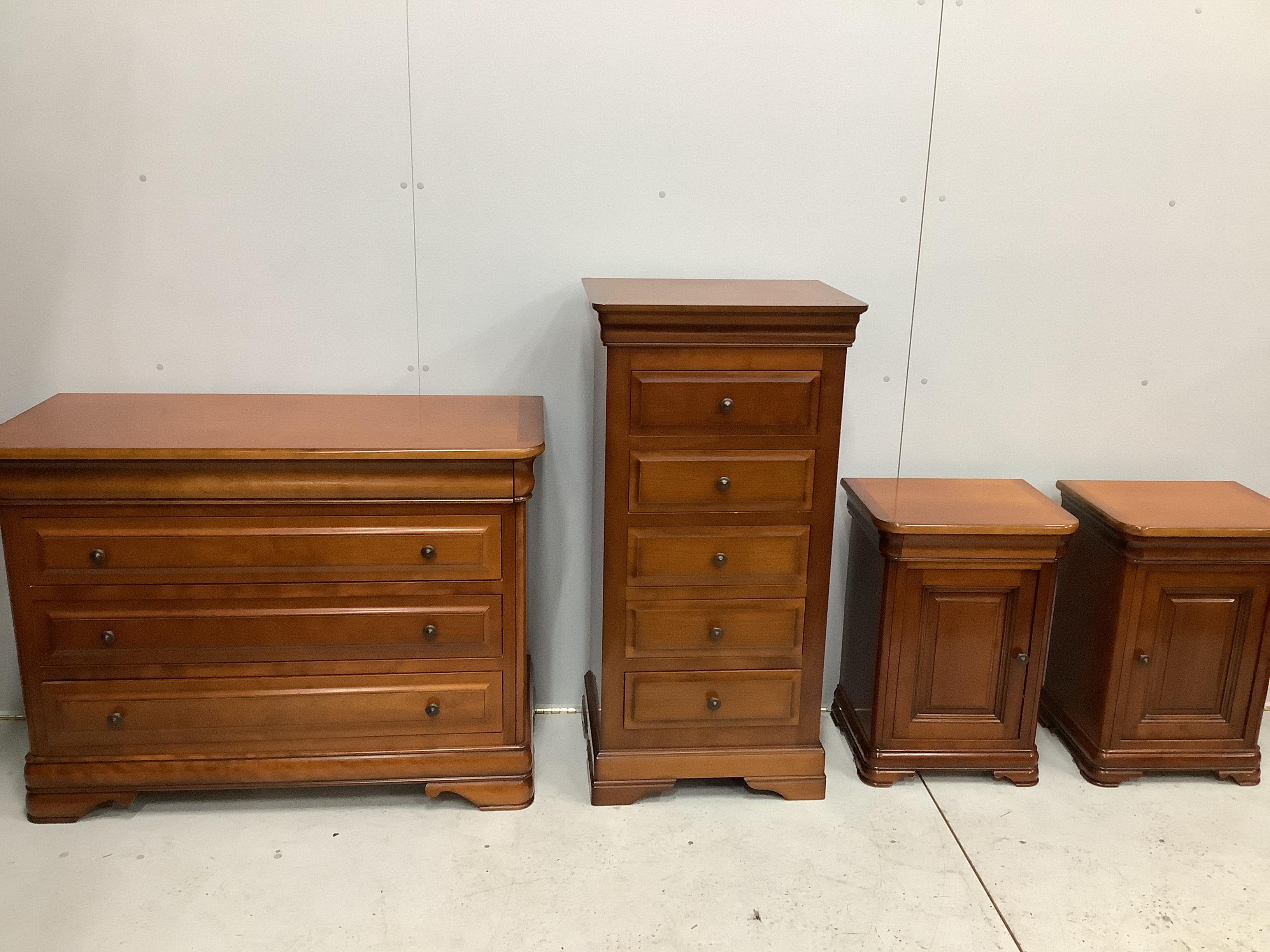 A French style cherry five piece bedroom suite, comprising triple wardrobe, four drawer chest, tall five drawer chest and a pair of bedside cabinets